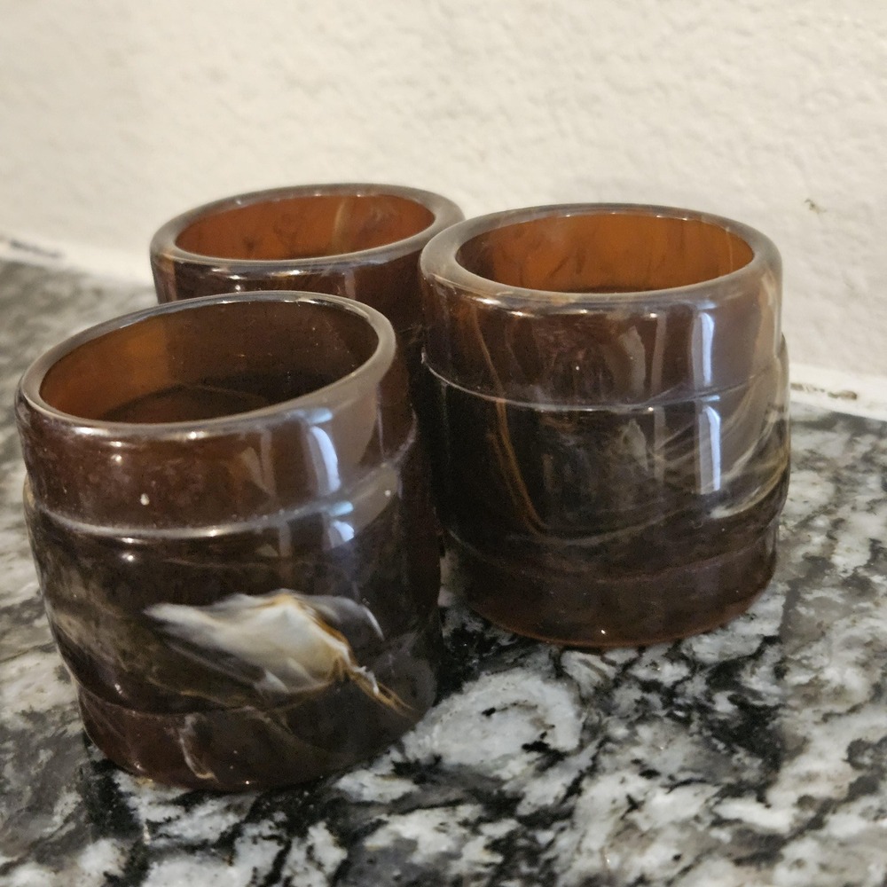 Set of 3 brown swirl like tortoise plastics or bakelite MCM‎ napkin rings